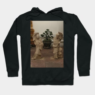 Stone sculptures from Asian woman and man at Wat Pho Buddha temple. 2 Hoodie